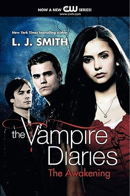 Paperback copy of The Vampire Diaries: The Awakening by HarperCollins, featuring a dark, mysterious cover with vampire-themed artwork.