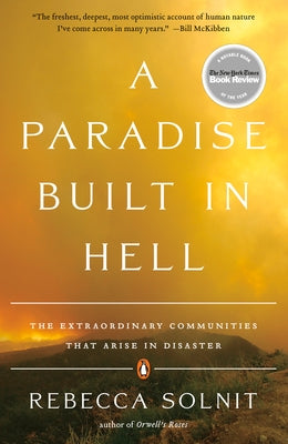 Paperback copy of "A Paradise Built in Hell" by Penguin Books showing the book cover with title and author.