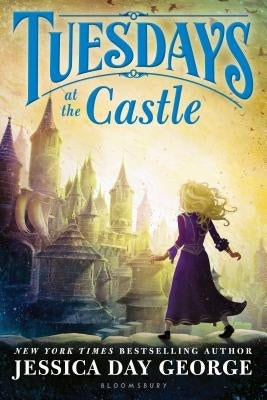 Paperback copy of "Tuesdays at the Castle" by Bloomsbury U.S.A. Children's Books, showing the book cover with colorful castle illustration.