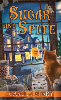 Mass market paperbound copy of "Sugar and Spite" by Kensington Cozies, featuring the book cover with title and author details.