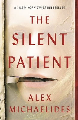 Paperback copy of "The Silent Patient" novel by Celadon Books featuring a minimalist cover design.