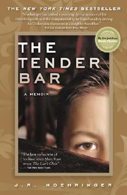 Paperback copy of The Tender Bar memoir by Grand Central Publishing, featuring a book cover with the title and author details.