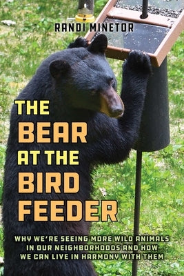 Paperback book titled "The Bear at the Bird Feeder" by Lyons Press, featuring a cover image with a bear near a bird feeder.