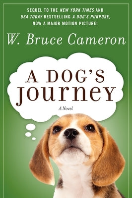 Paperback copy of "A Dog's Journey" by Forge, featuring the book cover with a dog and heartfelt title text.