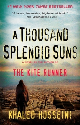 Paperback copy of "A Thousand Splendid Suns" by Riverhead Books, featuring the book cover with vibrant artwork.