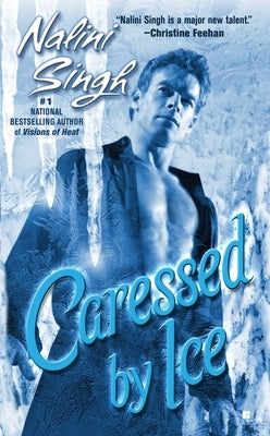Mass market paperback of "Caressed by Ice" by Nalini Singh, featuring a cover image with icy blue tones and fantasy artwork.