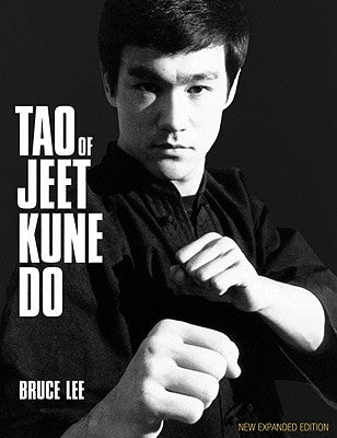 Paperback copy of The Tao of Jeet Kune Do by Black Belt Books, showing the book cover with martial arts artwork.