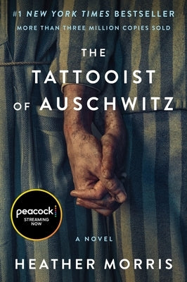 Paperback of The Tattooist of Auschwitz movie-tie-in by Harper Paperbacks, showing the book cover with title and author details.
