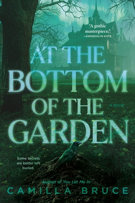 Paperback novel "At the Bottom of the Garden" by Del Rey Books, showing the book cover with garden scene artwork