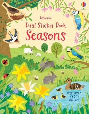 Usborne Books First Sticker Book Seasons in paperback with colorful seasonal stickers and illustrations for children.