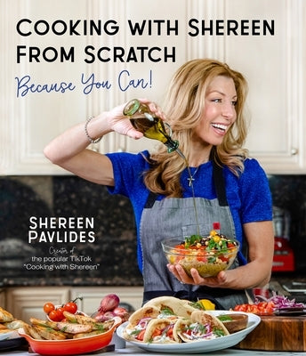 Paperback cookbook "Cooking with Shereen from Scratch" by Page Street Publishing, featuring colorful recipe pages and cooking tips.