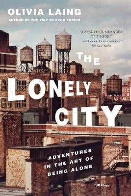 Paperback edition of The Lonely City by Picador USA, featuring a cover with urban art and a solitary figure.