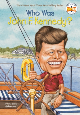 Paperback book titled "Who Was John F. Kennedy?" from Penguin Workshop, showing the front cover with a portrait of JFK.