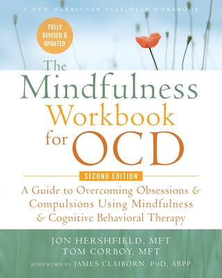 Paperback mindfulness workbook for OCD by New Harbinger Publications, featuring exercises to overcome obsessions and compulsions.