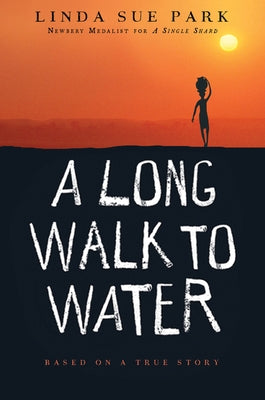 Paperback copy of "A Long Walk to Water" by Clarion Books, featuring the book cover with title and illustration.