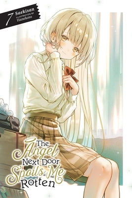 Paperback of The Angel Next Door Spoils Me Rotten Vol. 7 light novel by Yen On, featuring cover art with anime-style characters.