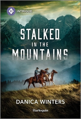 Mass market paperback of "Stalked in the Mountains" by Harlequin Intrigue featuring a rugged mountain landscape on the cover.