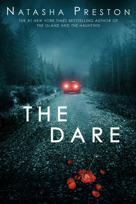 Paperback of "The Dare" by Delacorte Press, showing the book cover with bold title and colorful design.