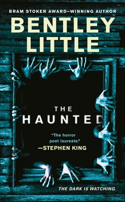 Mass market paperbound copy of "The Haunted" by Berkley Books, featuring a dark, eerie cover with ghostly imagery.