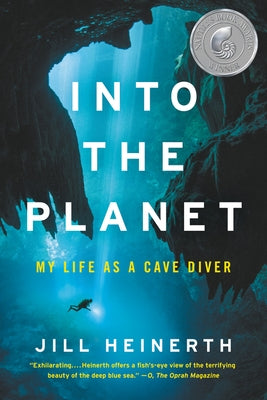 Paperback of "Into the Planet: My Life as a Cave Diver" by Ecco Press, showing the book cover with underwater cave images.