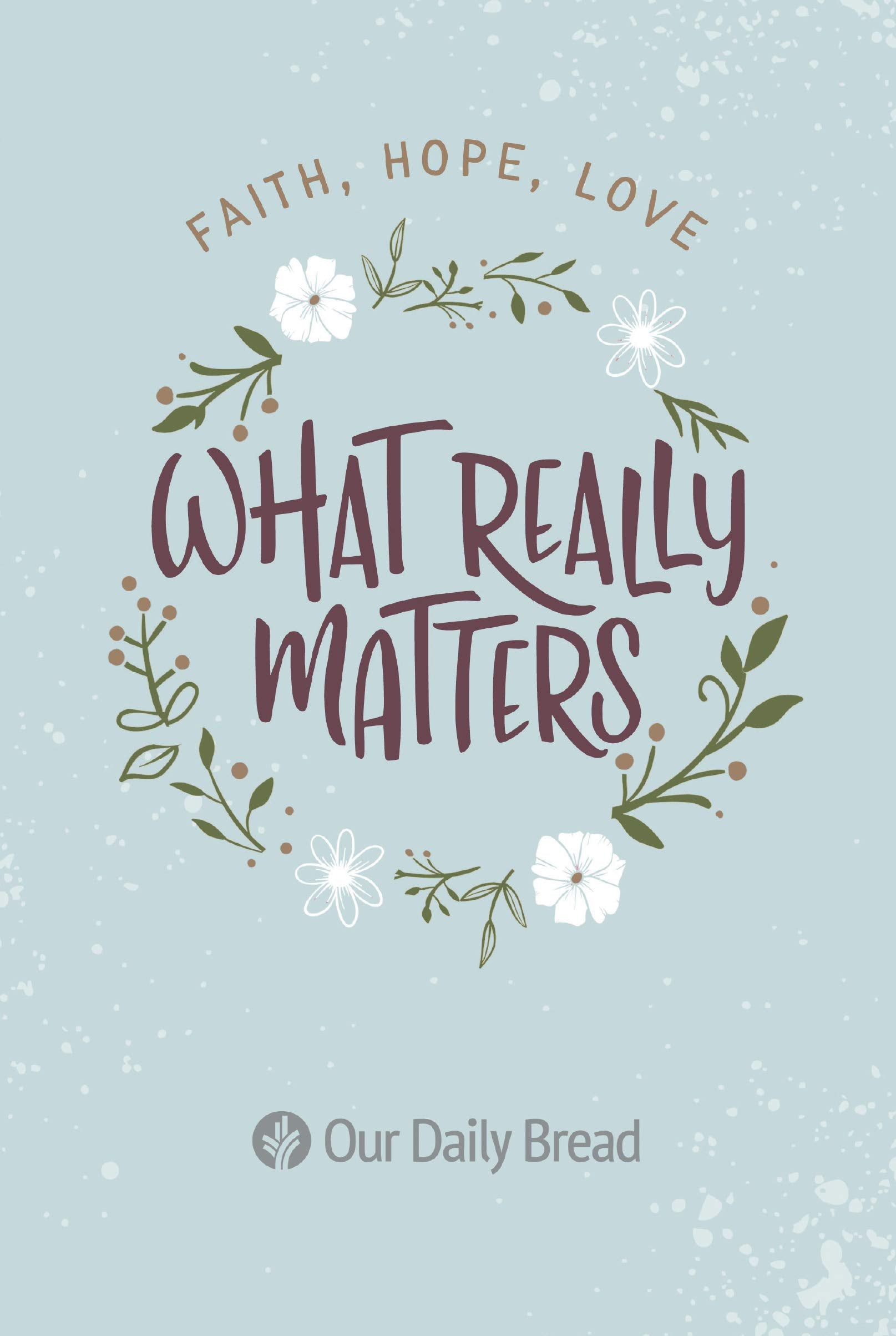 Paperback book titled "What Really Matters: Faith, Hope, Love" with daily devotions from Our Daily Bread Publishing.