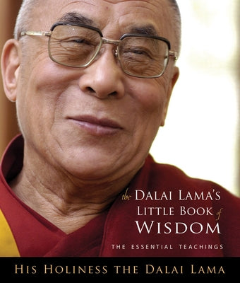 Open copy of Dalai Lama's Little Book of Wisdom by Hampton Roads Publishing Company, featuring a soft cover with gold lettering.