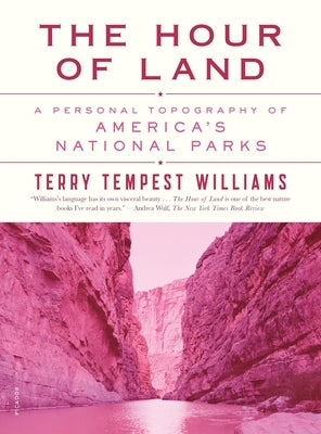 Paperback copy of "The Hour of Land" by Picador USA, featuring a cover with scenic national park imagery.