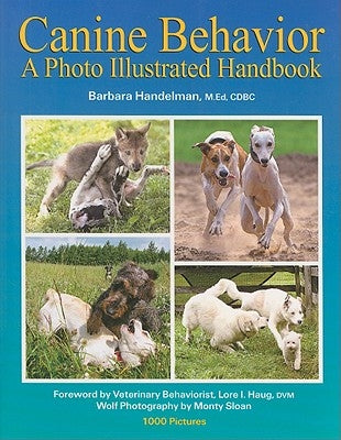 Paperback copy of "Canine Behavior: A Photo Illustrated Handbook" by Woof and Word Press, featuring a dog and book cover.