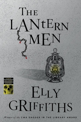 Paperback of The Lantern Men by Mariner Books, featuring the book cover with dark and mysterious design elements.