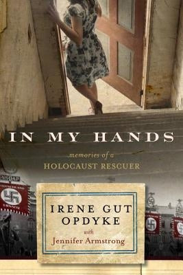 Paperback copy of "In My Hands: Memories of a Holocaust Rescuer" by Ember, featuring a close-up of the book cover.