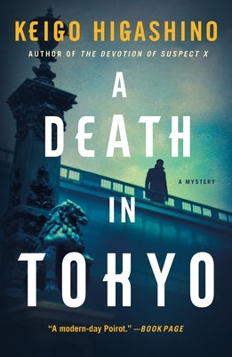Paperback copy of "A Death in Tokyo: A Mystery" by Minotaur Books, featuring the book cover with Japanese cityscape.