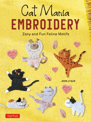 Paperback book titled "Cat Mania Embroidery" featuring colorful feline motifs on the cover, published by Tuttle Publishing.