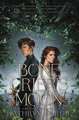 Paperback copy of Bone Crier's Moon by Katherine Tegen Books, featuring dark fantasy cover art with mystical moon imagery.