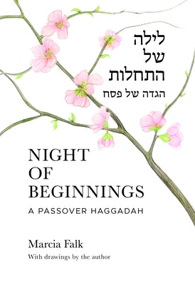 Paperback Night of Beginnings Passover Haggadah by Jewish Publication Society with open pages and Hebrew text.