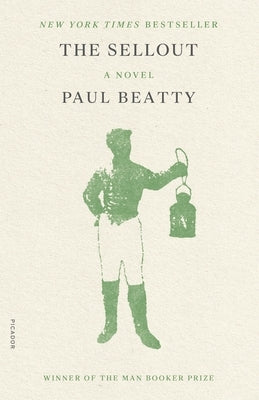 Close-up of the paperback book "The Sellout" by Picador USA with a black and white cover design.