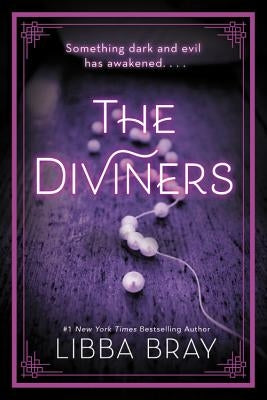 Paperback copy of The Diviners by Little, Brown Books for Young Readers, showing the book cover with dark and mystical artwork.