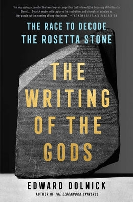 Paperback copy of The Writing of the Gods: The Race to Decode the Rosetta Stone by Scribner Book Company with a cover featuring ancient script.