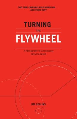 Paperback copy of "Turning the Flywheel" monograph by Harper Business, featuring a clean cover design and title text.