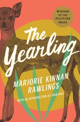 Paperback of "The Yearling" by Scribner Book Company, featuring a cover with a rural scene and vintage illustration.