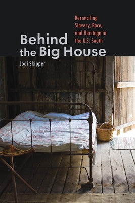 Paperback book titled "Behind the Big House" by University of Iowa Press, focusing on slavery, race, and heritage in the U.S. South.
