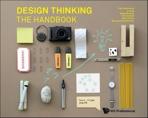 Paperback copy of "Design Thinking: The Handbook" by Ws Professional, showing the book cover with title and design elements.