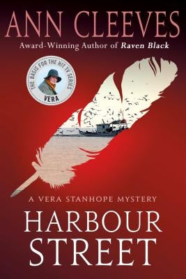 Paperback of Harbour Street novel by Minotaur Books, featuring its cover design with title and author details.