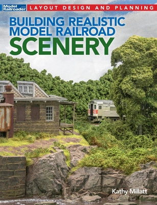 Paperback book titled "Building Realistic Model Railroad Scenery" by Kalmbach Media, featuring detailed model train landscape images.
