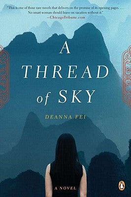 Paperback copy of "A Thread of Sky" by Penguin Books, featuring a cover with artistic sky and thread imagery.