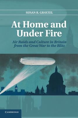 Paperback book titled "At Home and Under Fire" by Cambridge University Press, featuring historical air raids and British culture.