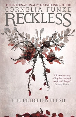 Paperback copy of Reckless I: The Petrified Flesh by Pushkin Children's Books, featuring dark, illustrated cover art.
