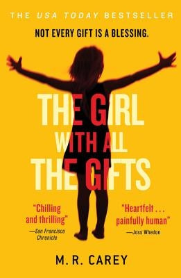 Paperback copy of The Girl with All the Gifts by Orbit, showing the book cover with dark and mysterious artwork.