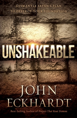 Paperback copy of "Unshakeable" by Charisma House, featuring the book cover with title and author name.