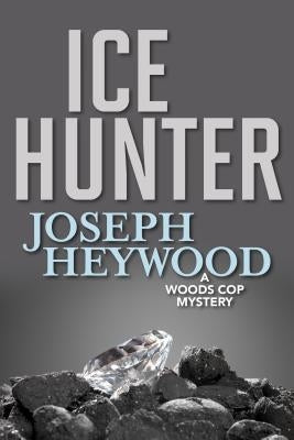 Cover of Ice Hunter: A Woods Cop Mystery book by Lyons Press, featuring a winter forest scene with a police badge and snow.