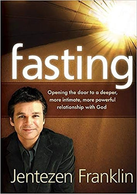 Paperback book titled "Fasting: Opening the Door to a Deeper, More Intimate, More Powerful Relationship With God" by Charisma House.